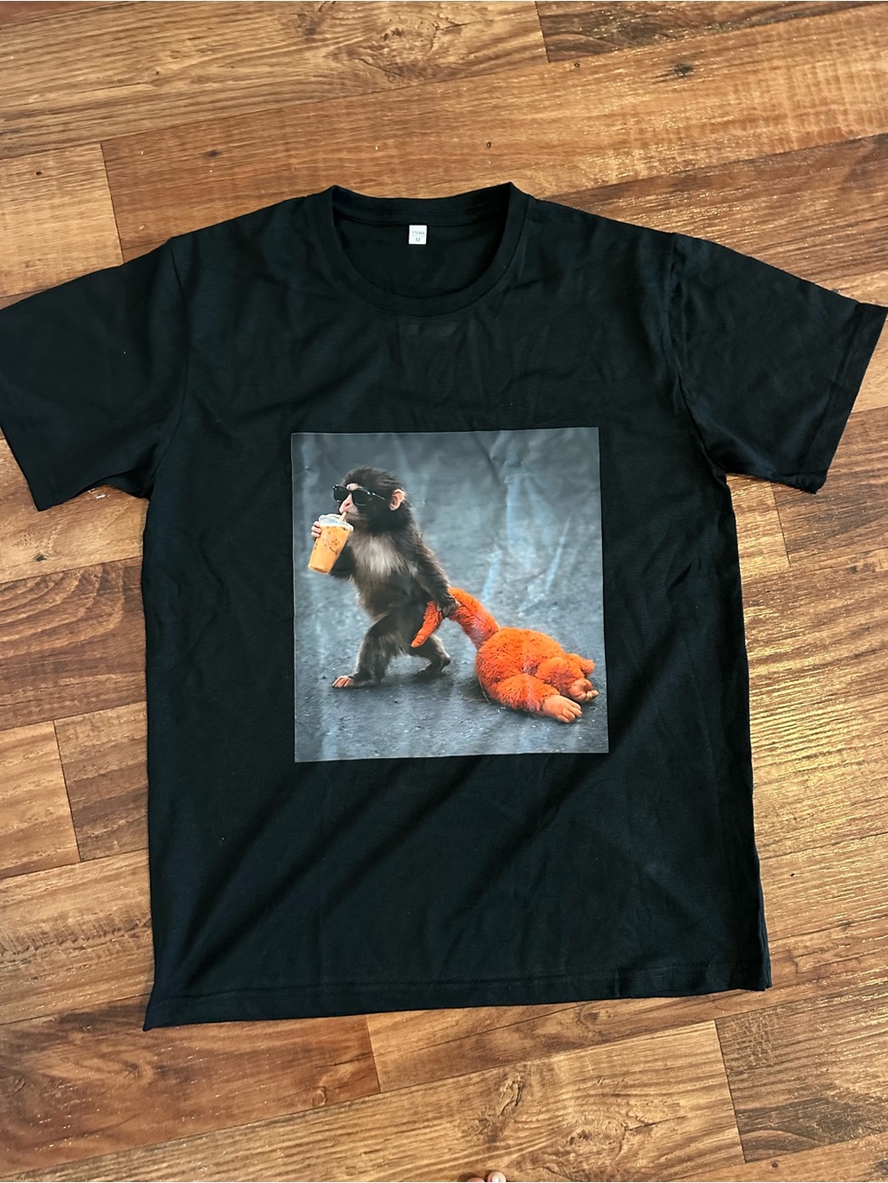 Black Graphic Tee with Monkey & Orange Plush Print